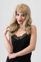 Ash blonde 50s style wig with short fringe and gentle waves: Trinity